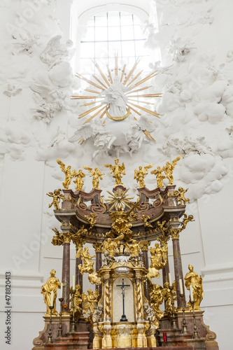 Golden altar in white church 