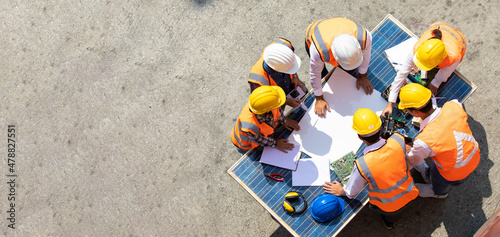 Ethnic diversity worker people, Success teamwork. Group of professional engineering people wearing hardhat safety helmet meeting with solar photovoltaic panels discussion in new project