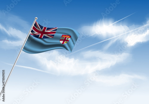 Flag of the Fiji on a stick, clear sky in the background