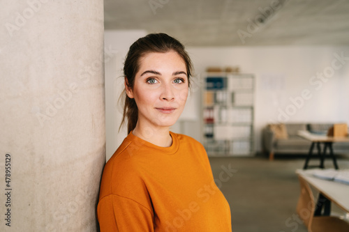 Attractive young woman looking thoughtfully at the camera