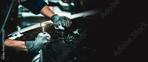 Car care maintenance and servicing, Close-up hand technician auto mechanic using the wrench to repairing change spare part car engine problem. Concepts of check and during periodic inspection service.