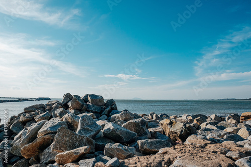 Skyline Beach View with Rocks and Sea against Clear Sky.