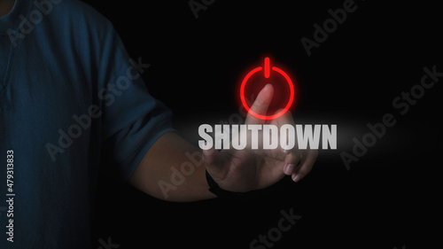 Human hand press shutdown button on virtual screen in the slide bar to unlocks. concept of system shutdown or stops working.