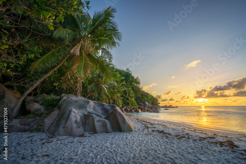 sunset at tropical beach anse georgette on praslin on the seychelles