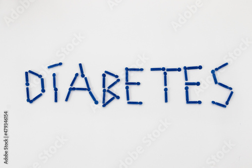 Diabetes lettering. Syringe pen for diabetic human insulin self injection, blood glucose meter and lancets