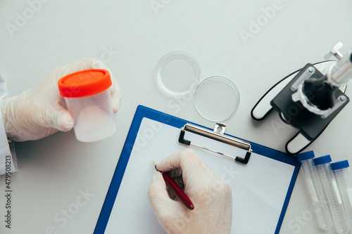 Doctor analyzing semen samples in laboratory. Doctor's workplace. Healthcare concept