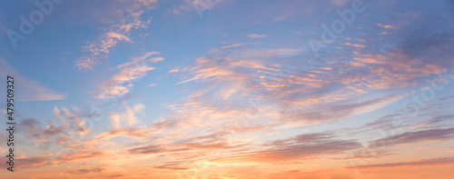 romantic colorful sunset panorama sky with rippled clouds