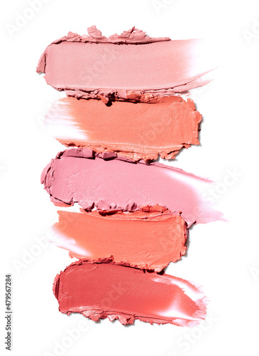 Few lipsticks smear on white background