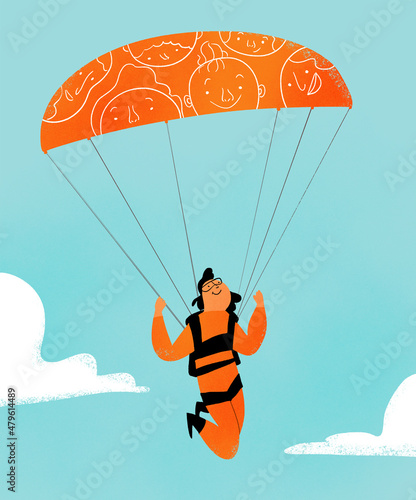 Person in the sky with face patterned parachute
