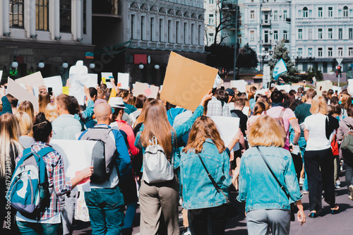 Young people marching on the street protest. Take a part in a march. Rally. Movement. Protest in the city