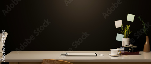 Modern hipster dark workspace with tablet touchpad and copy space on table