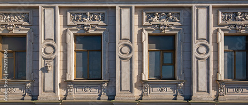 Vintage building facade wall. Rounded windows. Classic architecture historic buildings of St. Petersburg.