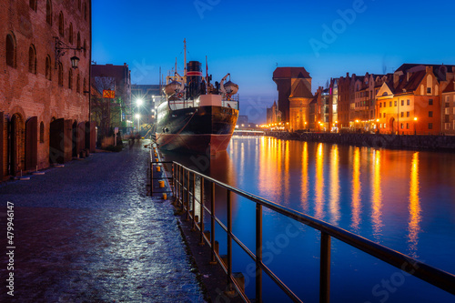 Amazing architecture of Gdansk old town by the Motlawa River at dusk. Poland