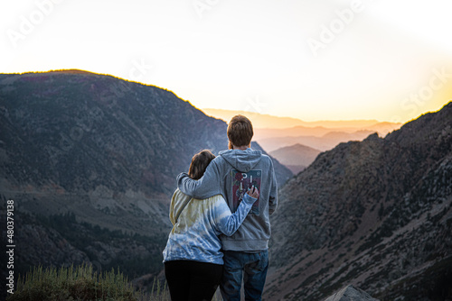 Couple In Love Watching Mountain Sunrise in Yosemite National Park After Hike