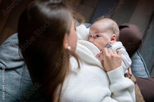 Woman breastfeeding newborn baby. Mother breastfeeding newborn boy. concept breastfeeding. Baby eating mother's milk. Young woman nursing and feeding baby. concept of lactation infant.