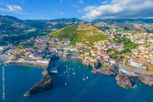 Aerial drone view of Camara de Lobos village panorama near to Funchal, Madeira. Small fisherman village with many small boats in a bay