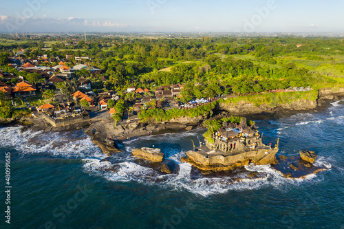 Aerial view of the famous Balinese Hindu Tanah Lot temple in Bali, Indonesia.