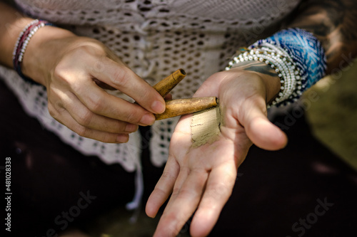 Paulo, SP, Brazil - November 23 2021: Hands of caucasian women holding kuripe and snuff details.