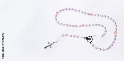 Holy catholic rosary and a cross - Text space