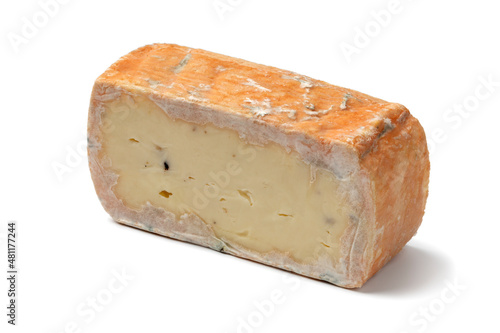 Piece of Italian taleggio with tuber isolated on white background close up