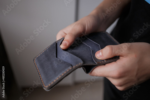 Man holding a leather wallet 