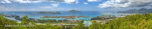 Panoramic aerial view of Eden Island and Mahe seascape from the hill at sunset, Seychelles.