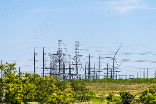 Wind turbine farm generator and power station electricity grid near Snyder Texas in USA in prairie with many machines for energy