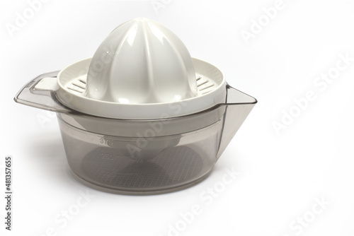 Closeup orange lemon squeezer container white background