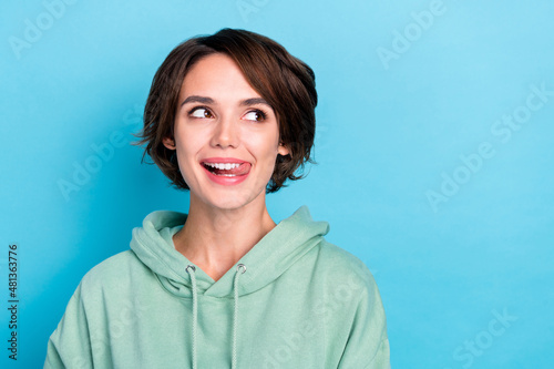 Photo of pretty millennial bob hairdo lady look promo wear green pullover isolated on blue color background