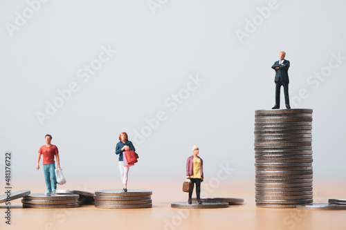 Businessman standing on highest coins stacking and shopper standing on lower coins pile for investment can make more money and opportunity to richer concept.