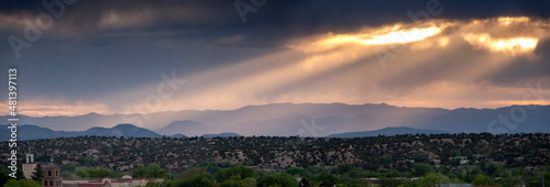 This beautiful sunset landscape view in Santa Fe New Mexico ephasizes the layers of light in the mountaiins surrounding this city different.