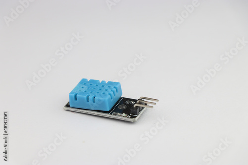 DHT11 temperature and humidity sensor module isolated on white background with side view
