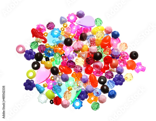 Pile of bright colorful beads on white background, top view