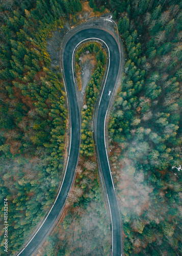 Serpentine roads in Ukraine, fog in the mountains, serpentine road in the fog, drove on top of the road.