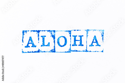Blue color ink rubber stamp in word aloha on white paper background