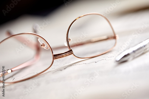 eyeglasses on the newspaper pages