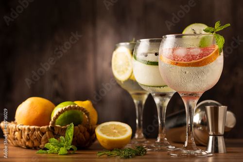 Three glasses of gin tonic cocktail on the table.