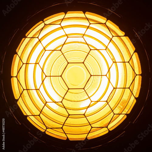 Directional yellow light from Fresnel lens closeup front view