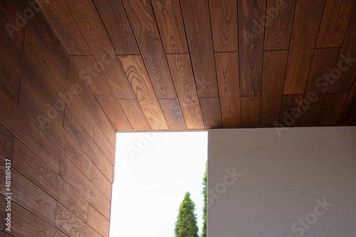 Exterior architecture fragment of thermal wood ceiling and wall cladding