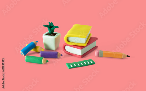 Student work desk with educational supplies made from plasticine