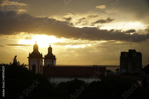 The two church towers of the Metropolitan Cathedral, the Church of Our Lady (Igreja Matriz) against sunlight at sunset. Historic district of Manaus, Amazonas, Brazil.