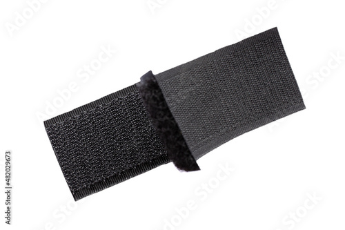 Contact tape isolated on white background, top view. Black velcro on a white background. Velcro fastener for clothes isolated on white background, top view. Black velcro, top view.