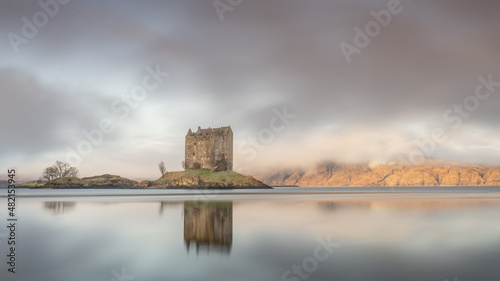 Castle Stalker near Appin and Glencoe in the Scottish Highlands. Landscape photography with a misty backdrop