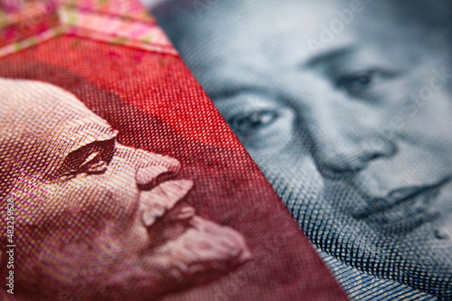 Close-up of a Chinese yuan and a Russian ruble banknote