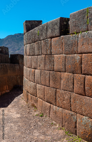 Inca wall by the sun temple of Pisac, Sacred Valley of the Inca, Cusco, Peru.