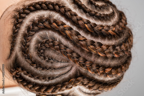 Close-up of braids on the head of a caucasian woman.