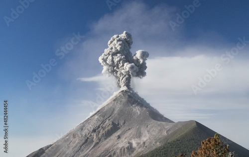 Close view of Fuego volcano eruption, molten rocks, hot ash, gas and smoke belched up from the crater during explosion. Acatenango volcano trek. Natural disaster in Guatemala, Central America.