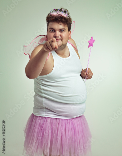 I've got something for you. An overweight man in a pink fairy costume pointing at the camera.