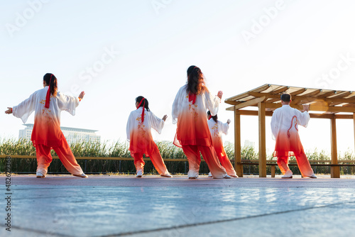A group performs tai Chi, a Chinese martial art
