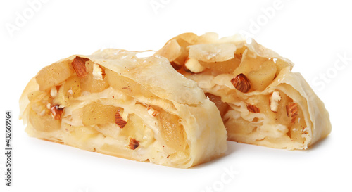 Pieces of delicious apple strudel with almonds on white background